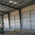 Butler wall insulation with WMP 50 facing providing energy efficiency, vapor protection, and bright interior finish for metal buildings