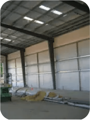 Butler wall insulation with WMP 50 facing providing energy efficiency, vapor protection, and bright interior finish for metal buildings