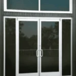Butler Building aluminum storefront door with 10‑inch ADA bottom rail, insulated glazing, and optional sidelites or transoms