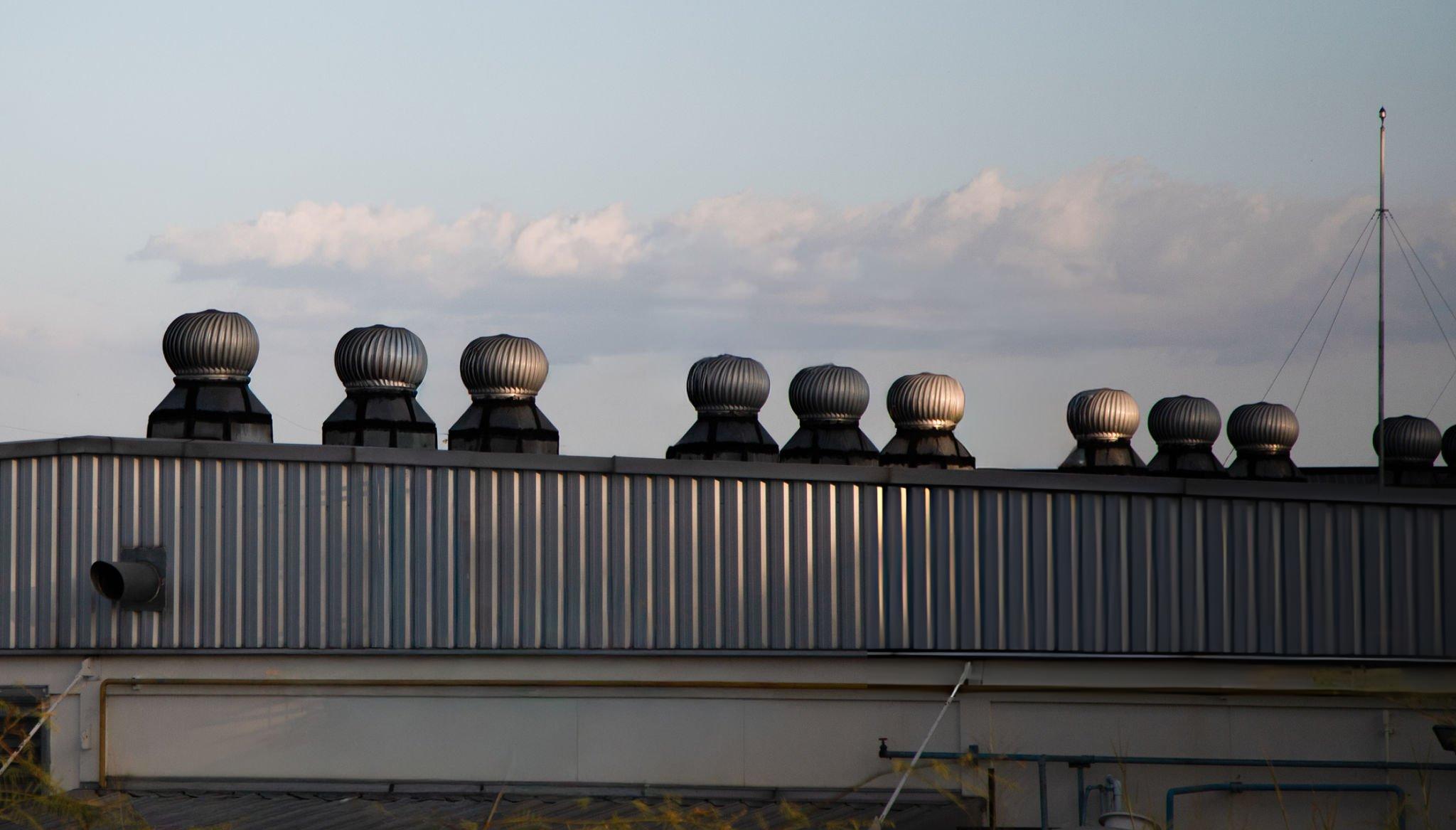 Butler Building turbine vent installed on a Butler metal roof showing precision balanced turbine assembly bird screen and wide flange base engineered for long-term passive ventilation performance