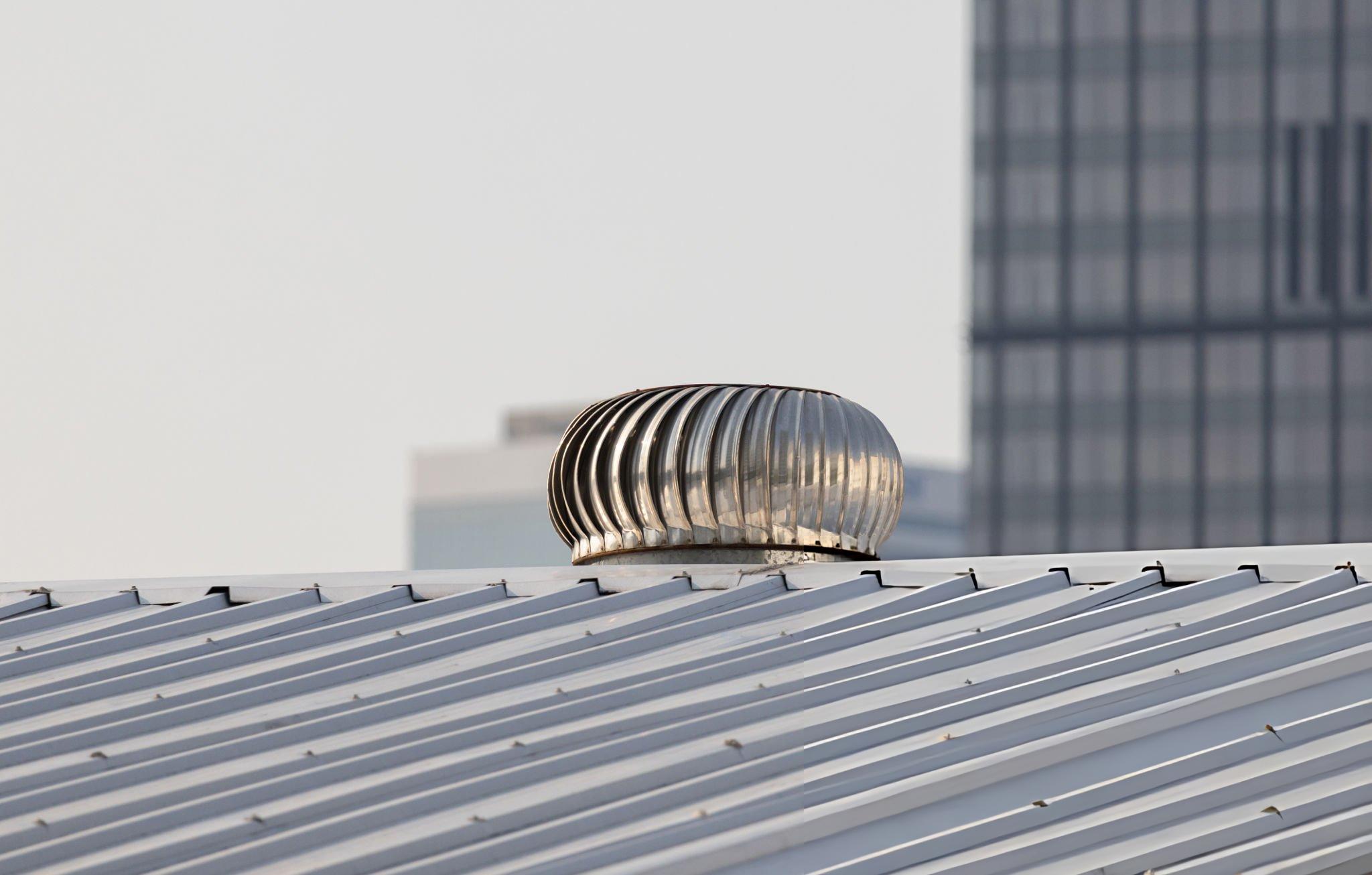 Butler Building turbine vent installed on a commercial metal roof providing wind-driven passive ventilation to reduce heat buildup humidity and stale air in industrial and warehouse applications