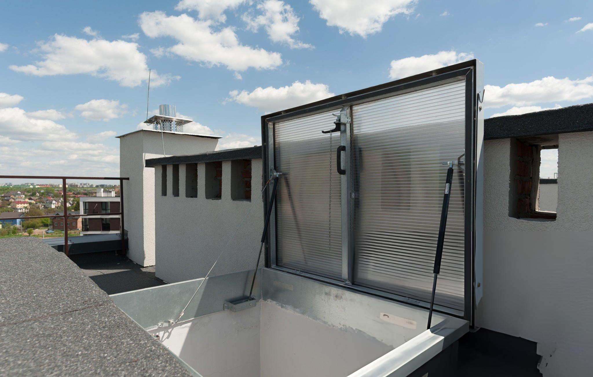 OSHA-compliant Butler Building roof hatch with fall protection safety railing per CFR 29 1910.28 requirements