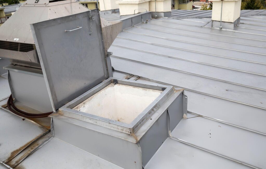 Butler Building smoke ventilation system installed on commercial metal building roof providing emergency smoke and heat evacuation for warehouses manufacturing facilities and aviation hangars