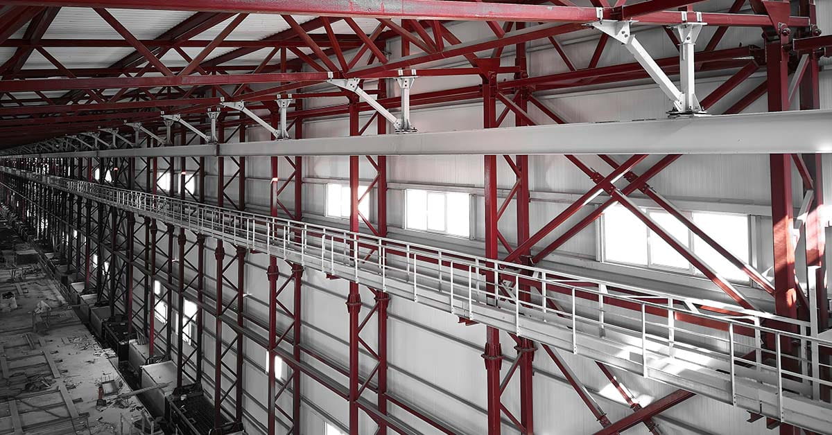 Butler Building catwalk system installed inside a commercial metal building with OSHA-compliant guardrails and open steel grating walkway