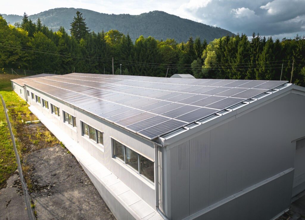 Butler Close-up of blue photovoltaic solar panels mounted on building roof for producing clean ecological electricity