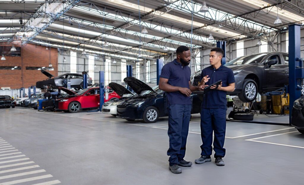 Butler Mechanics discussing the diagnosis of a car
