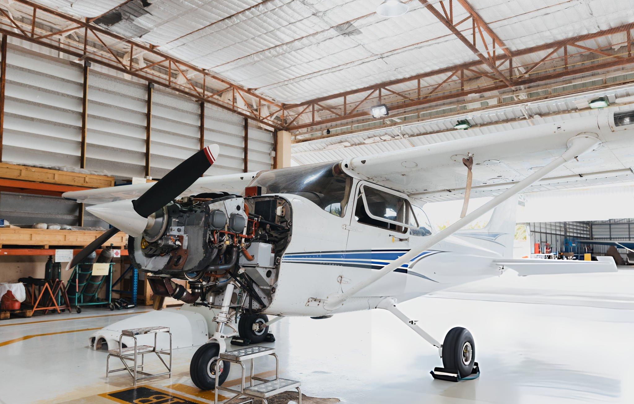 Butler White airplane in maintenance at hangar