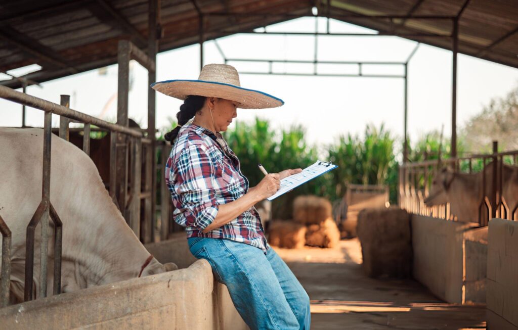 Butler farmer inspecting and recording information