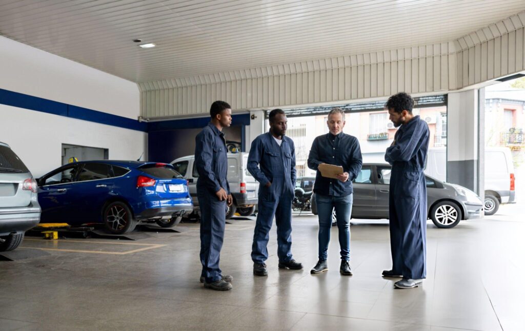 Butler mechanics at a car garage